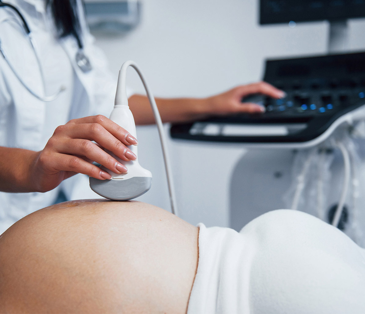 female-doctor-does-ultrasound-pregnant-woman-hospital copy